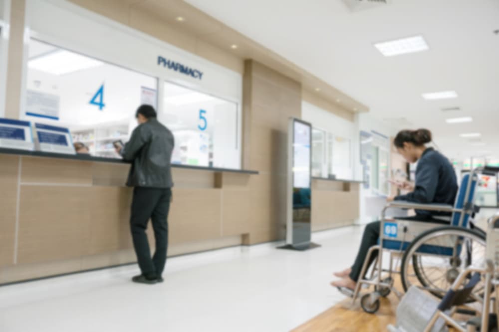 Blurry Background of people paying for medical expenses.